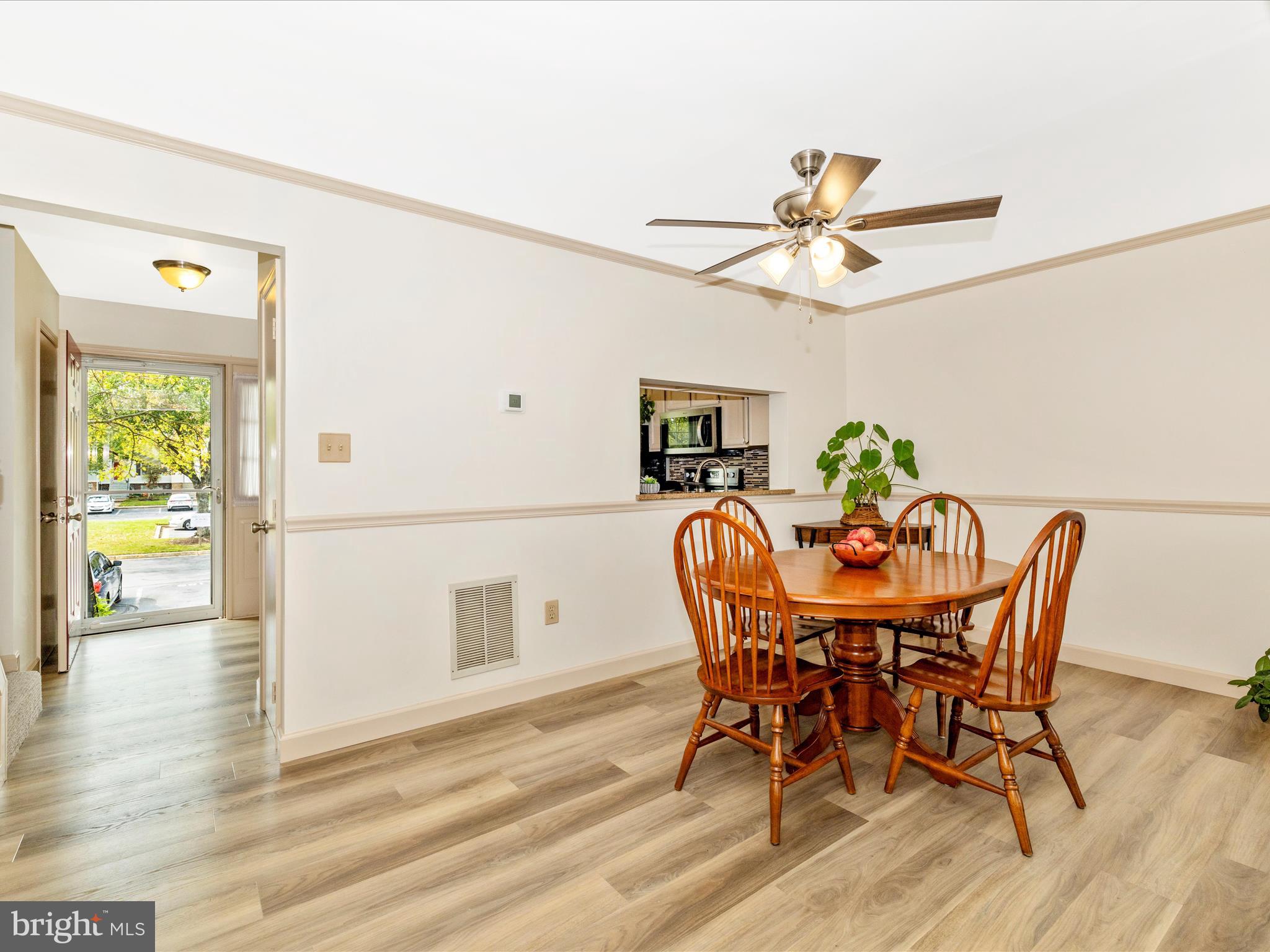 6739 Killdeer Court Frederick, MD 21703 - Photo 13 of 38 a view of a dining room with furniture and a window