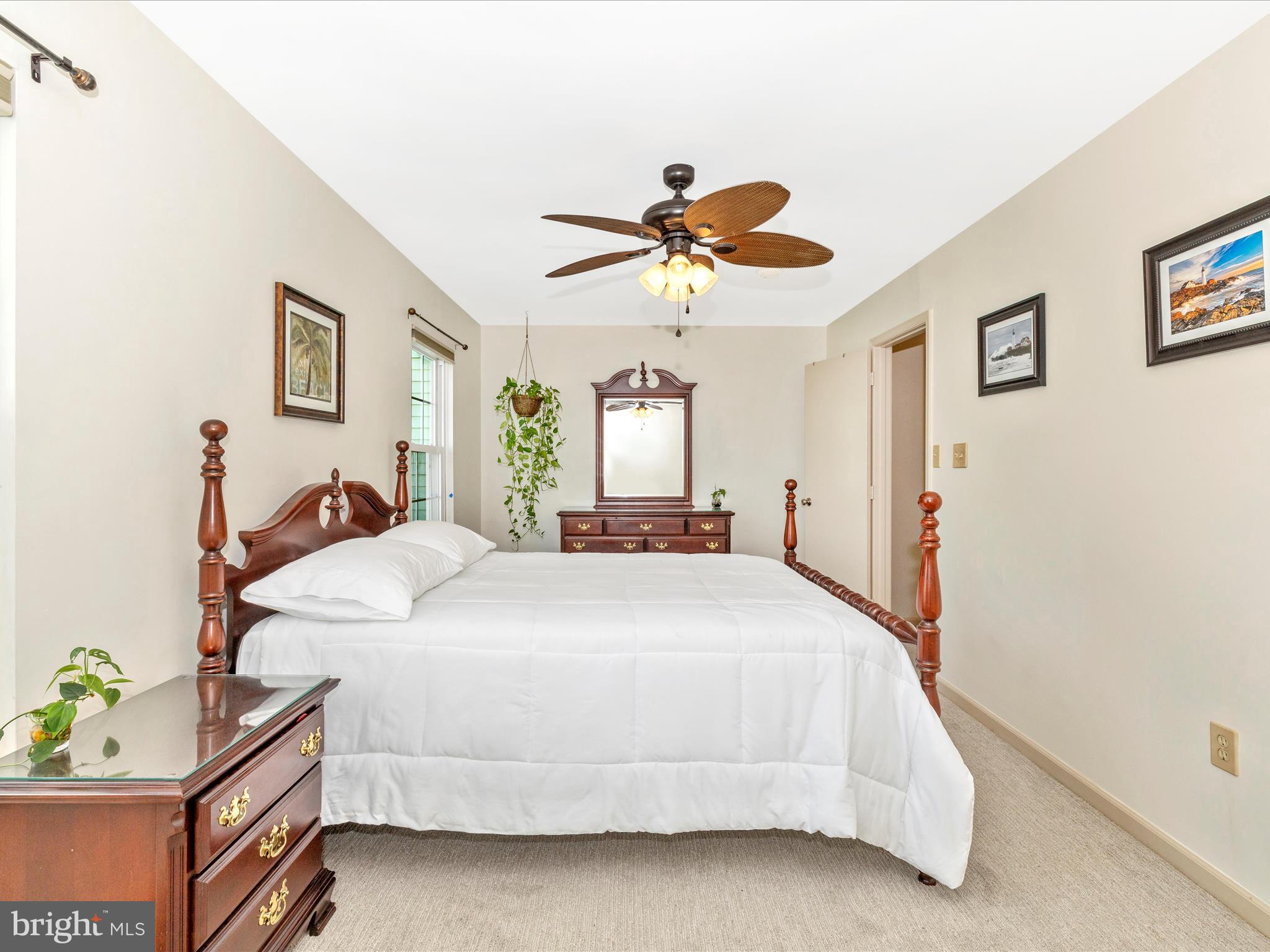6739 Killdeer Court Frederick, MD 21703 - Photo 19 of 38 a bed room with a bed and a chandelier