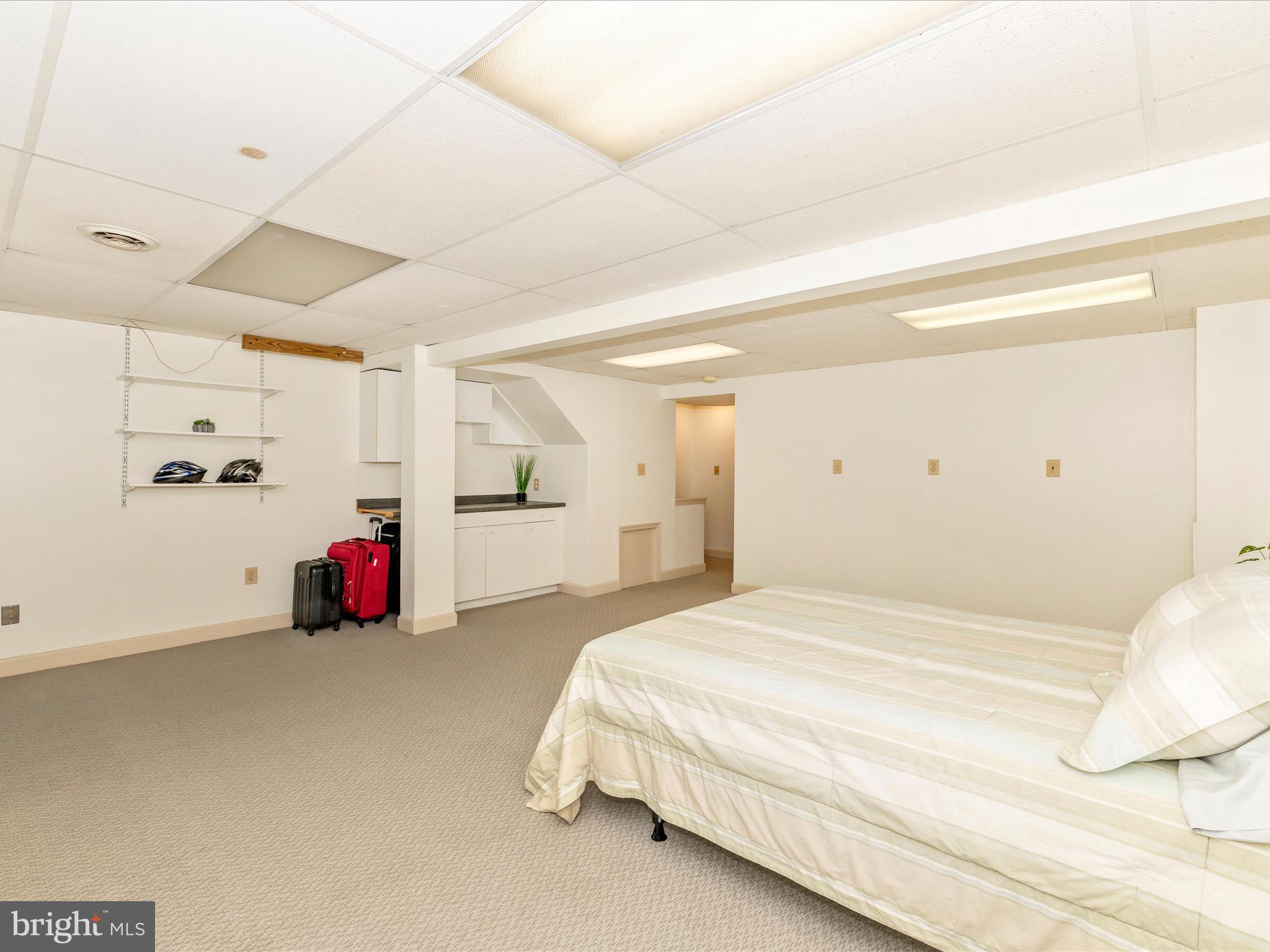 6739 Killdeer Court Frederick, MD 21703 - Photo 27 of 38 a bedroom with a bed and cabinets