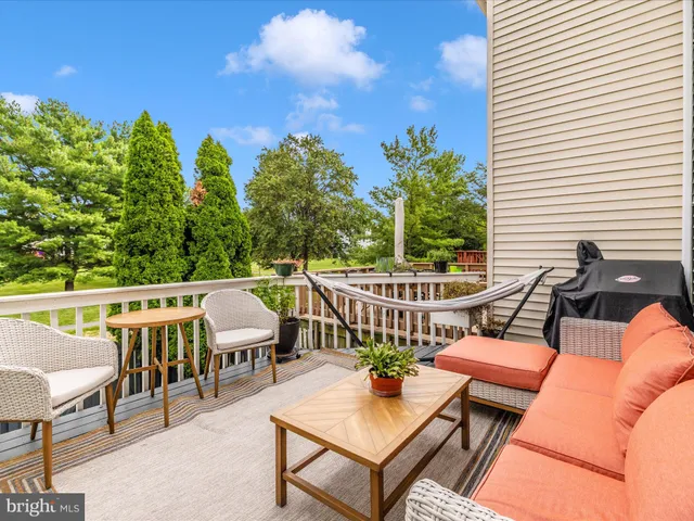 a view of a chairs and table in patio