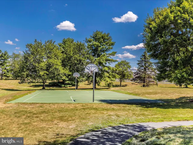 a view of a swimming pool with an outdoor space and seating area