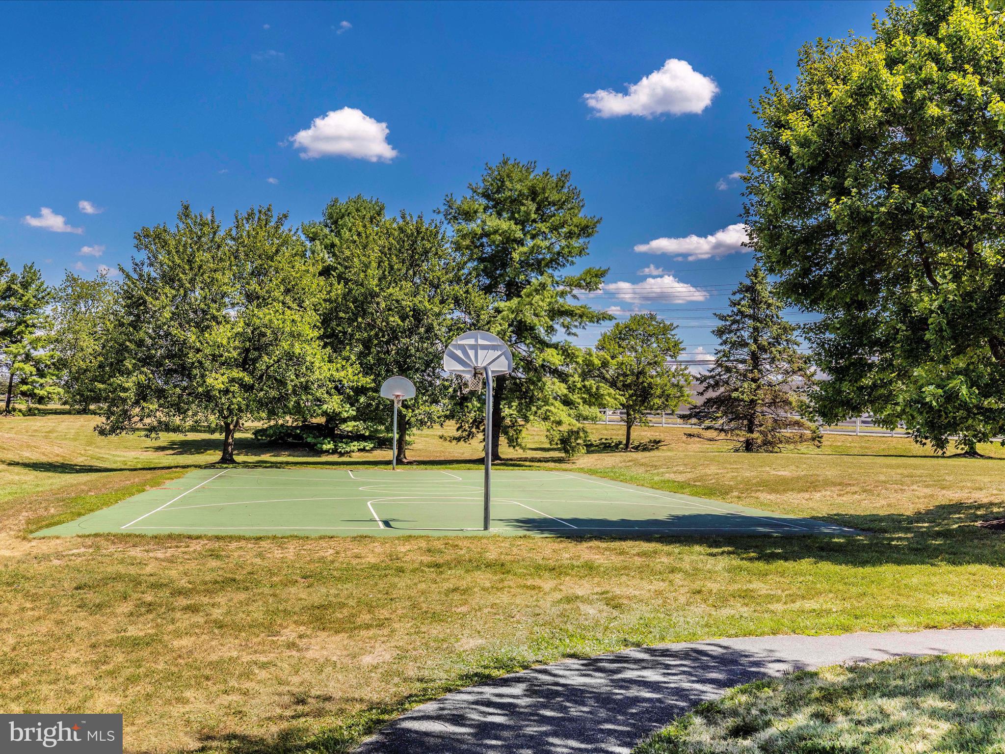 6739 Killdeer Court Frederick, MD 21703 - Photo 37 of 38 a view of a swimming pool with an outdoor space and seating area