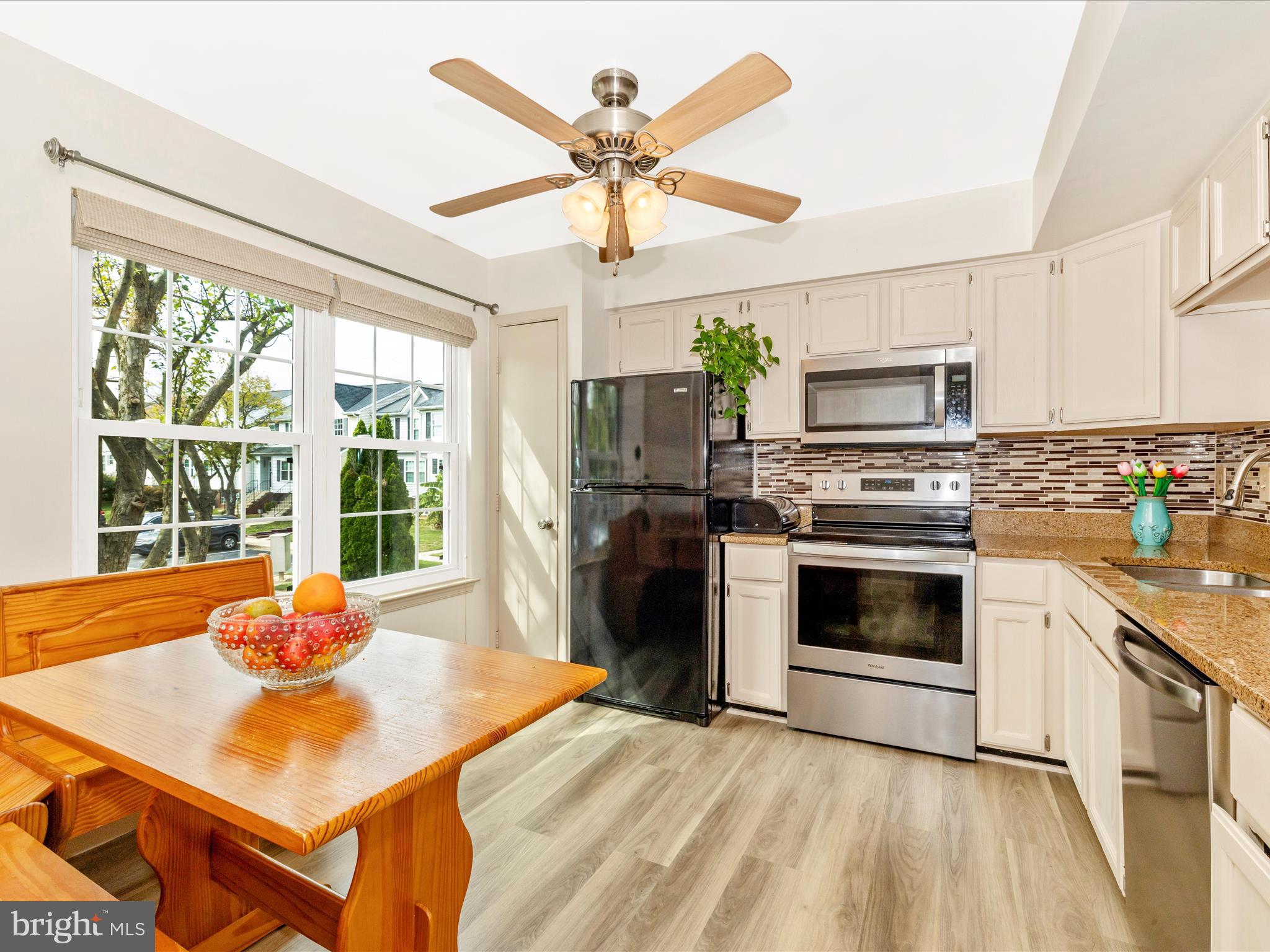 6739 Killdeer Court Frederick, MD 21703 - Photo 5 of 38 a kitchen with a stove a sink and a refrigerator