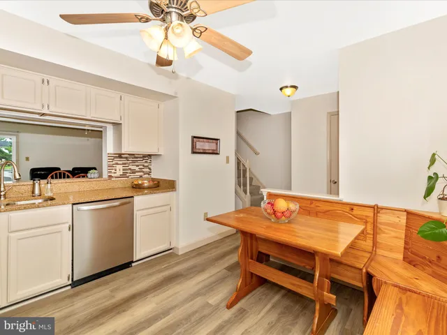a reading room with furniture and wooden floor