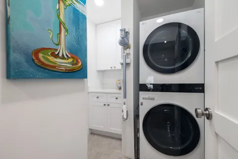 a living room with dryer and washer