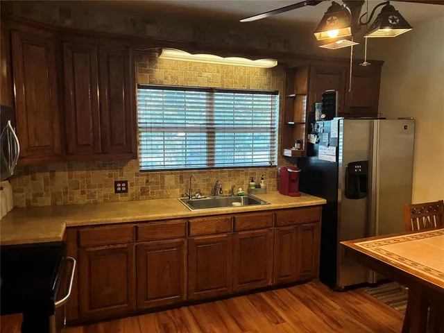 a kitchen with a sink and cabinets