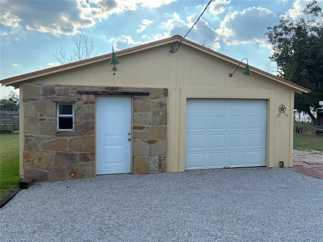 a front view of a house with a garage