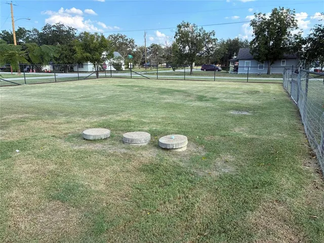 a view of a car park in front of a house