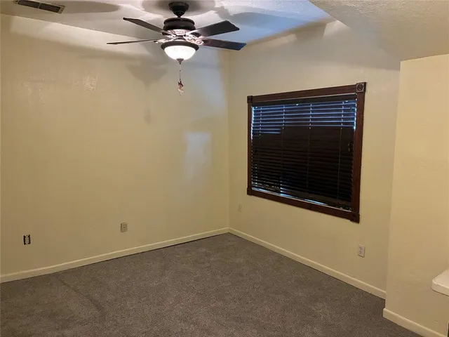 a view of a hallway with a window
