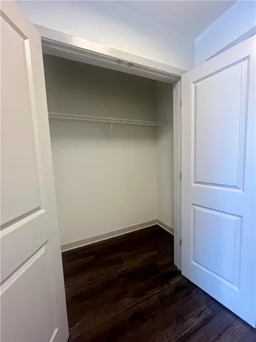 a view of kitchen with cabinets and wooden floor