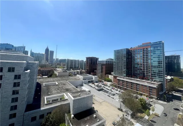 a view of a living room with wooden floor