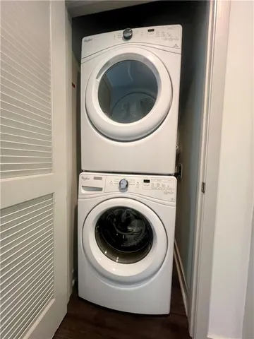 a room with wooden floor and ceiling fan