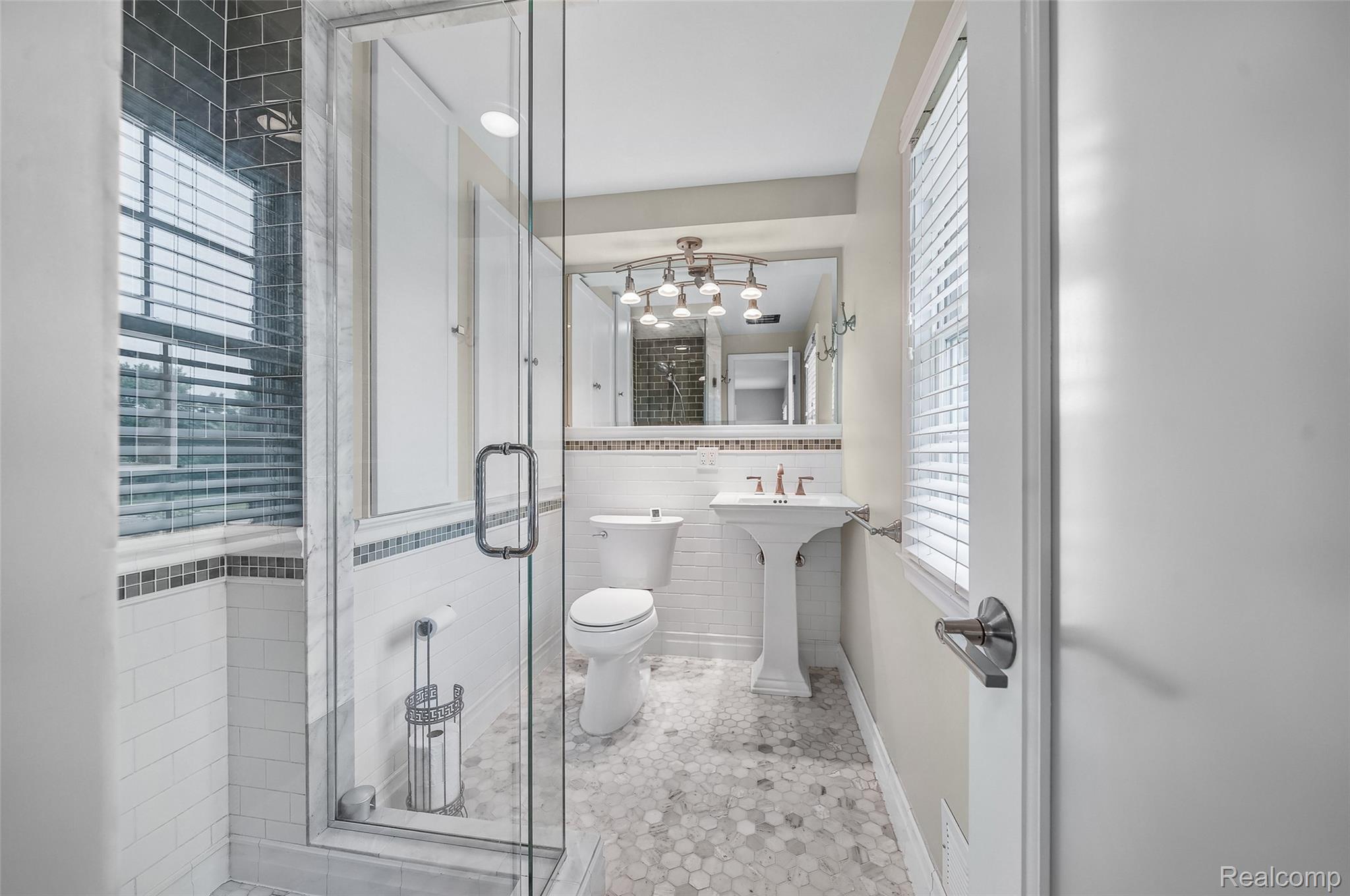 100 Overhill Road Bloomfield Hills, MI 48301 - Photo 30 of 55 Bathroom featuring a shower stall, tile walls, and light tile patterned flooring