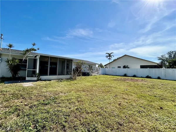 a house view with a backyard space