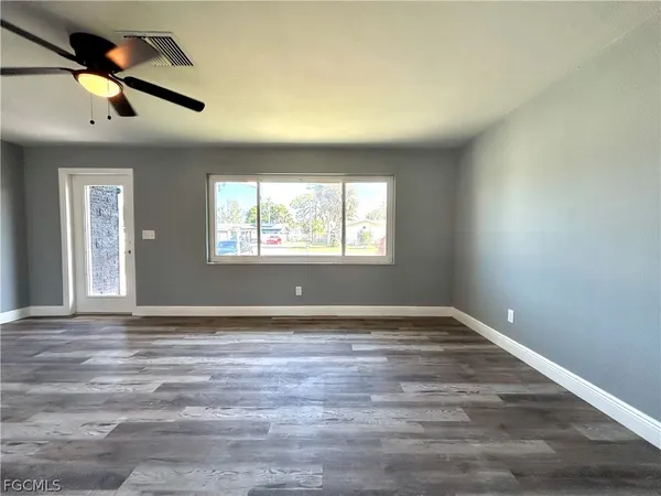 a view of an empty room and window