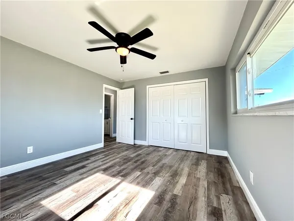 a view of an empty room and wooden floor