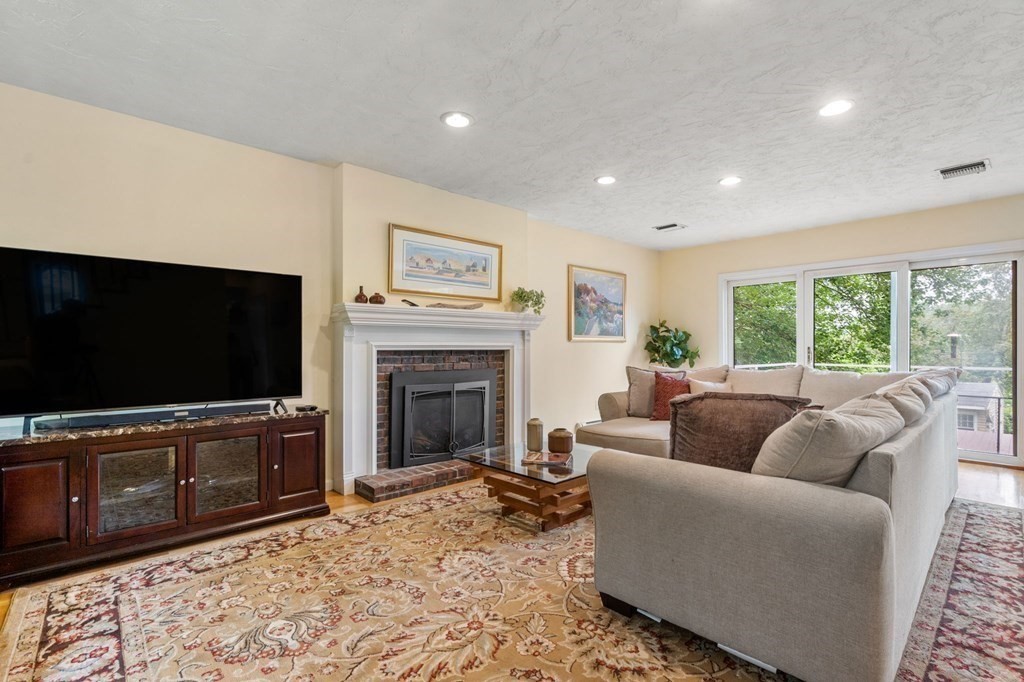 96 Bridge Street Medfield, MA 02052 - Photo 13 of 41 a living room with furniture and a flat screen tv
