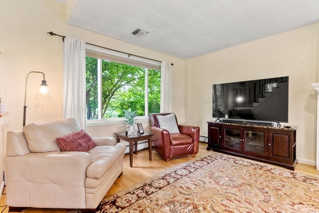 96 Bridge Street Medfield, MA 02052 - Photo 14 of 41 a living room with furniture and a flat screen tv