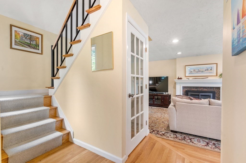 96 Bridge Street Medfield, MA 02052 - Photo 18 of 41 a view of a kitchen with furniture and staircase