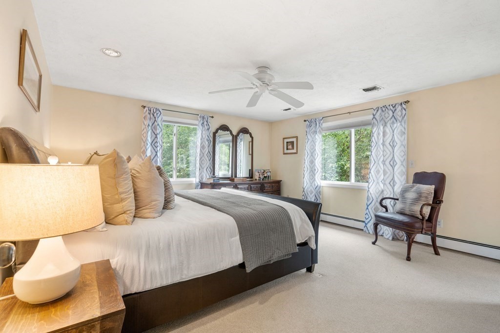 96 Bridge Street Medfield, MA 02052 - Photo 19 of 41 a bedroom with a bed and a couch