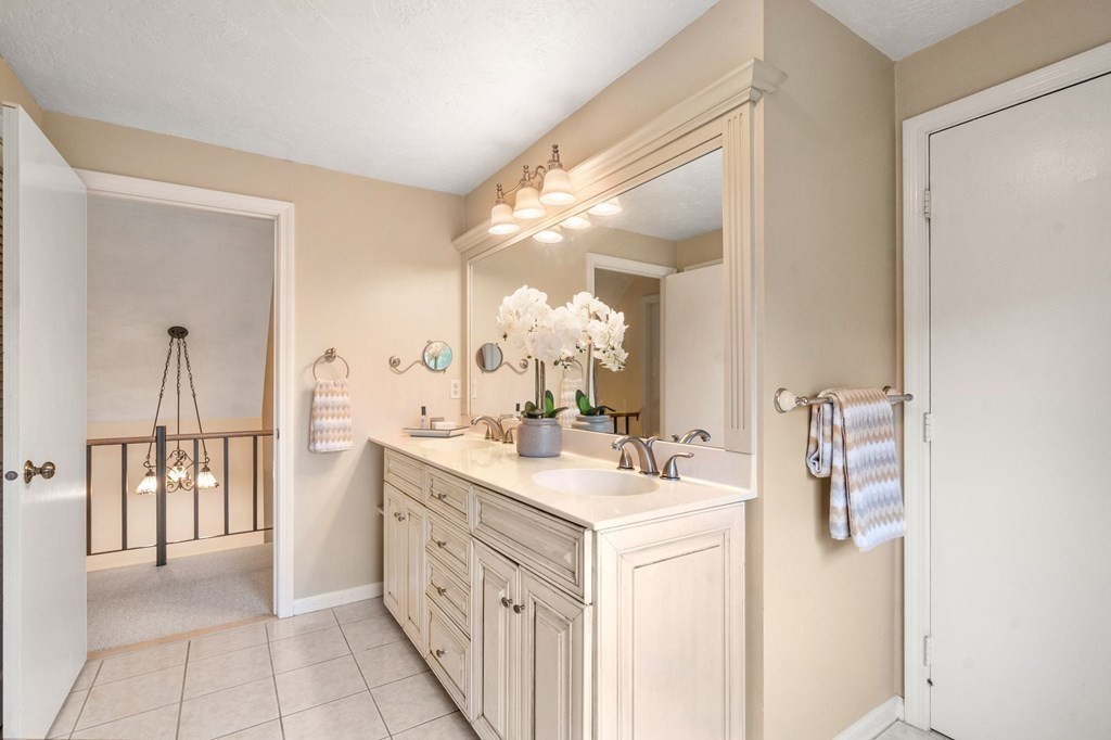 96 Bridge Street Medfield, MA 02052 - Photo 21 of 41 a spacious bathroom with a double vanity sink and a mirror