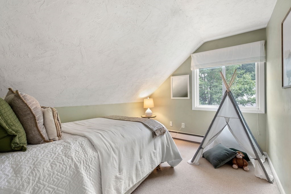 96 Bridge Street Medfield, MA 02052 - Photo 24 of 41 a bedroom with a bed and a window
