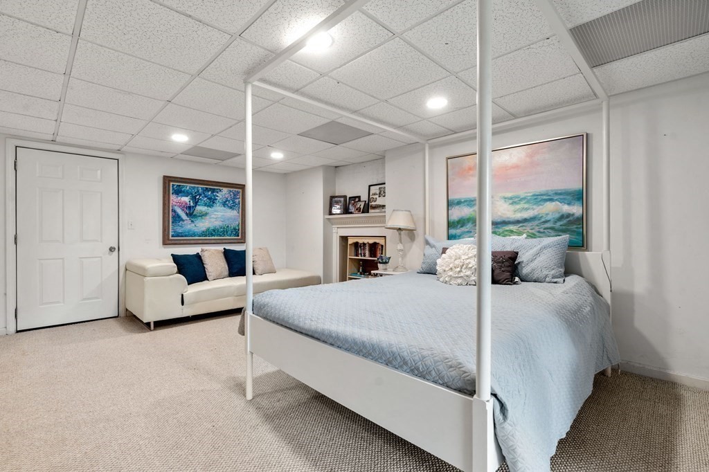 96 Bridge Street Medfield, MA 02052 - Photo 26 of 41 a bed room with a bed and a large window