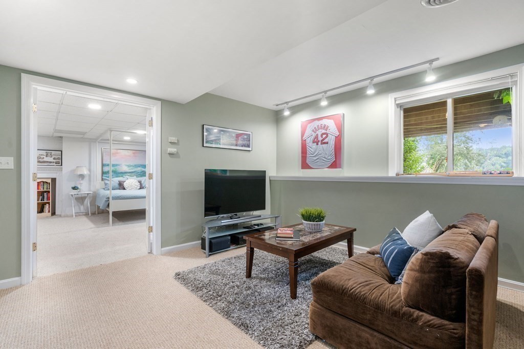 96 Bridge Street Medfield, MA 02052 - Photo 28 of 41 a living room with furniture and a flat screen tv