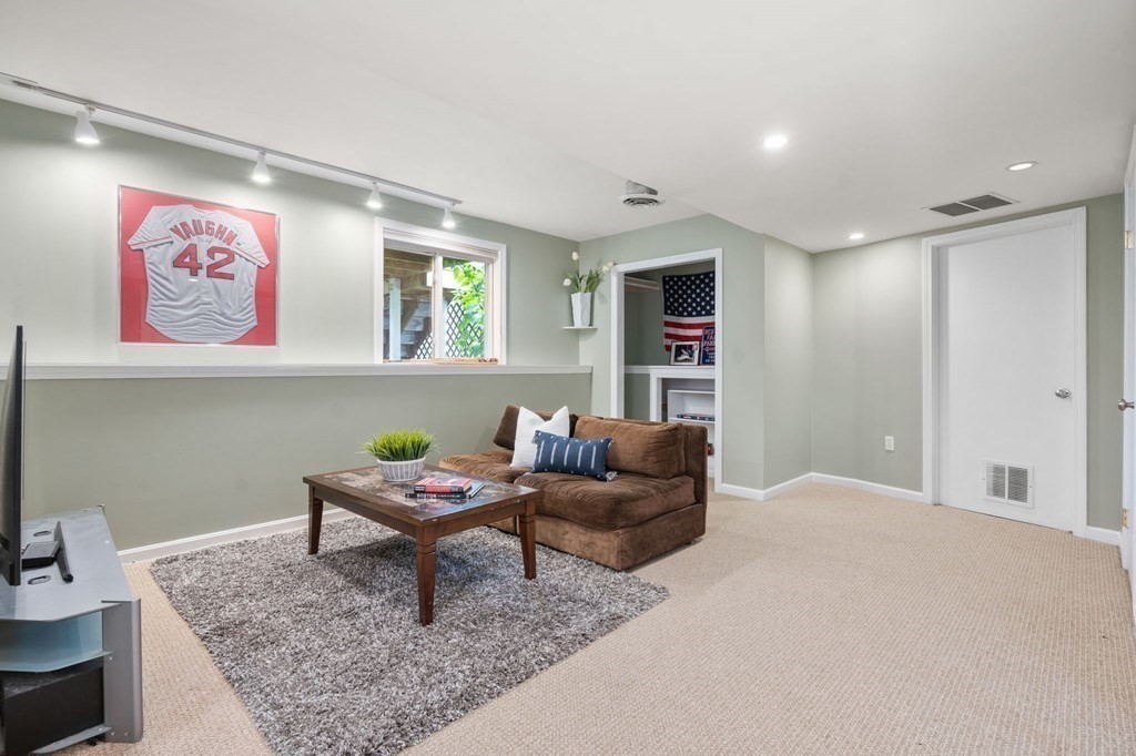 96 Bridge Street Medfield, MA 02052 - Photo 29 of 41 a living room with furniture and a table