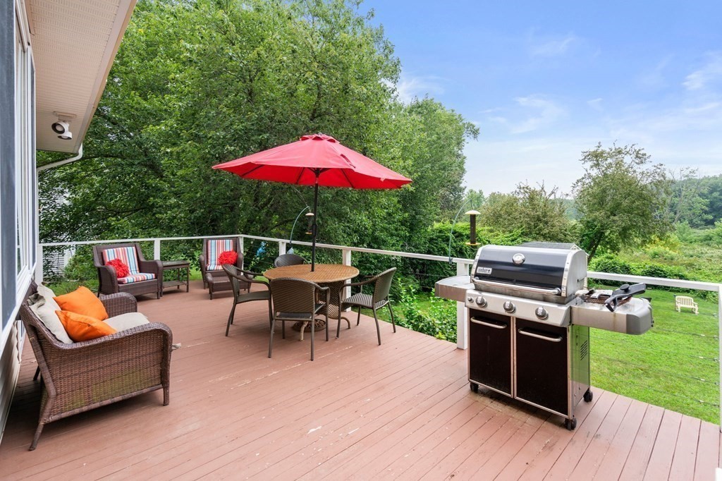 96 Bridge Street Medfield, MA 02052 - Photo 33 of 41 an outdoor sitting area with furniture and garden