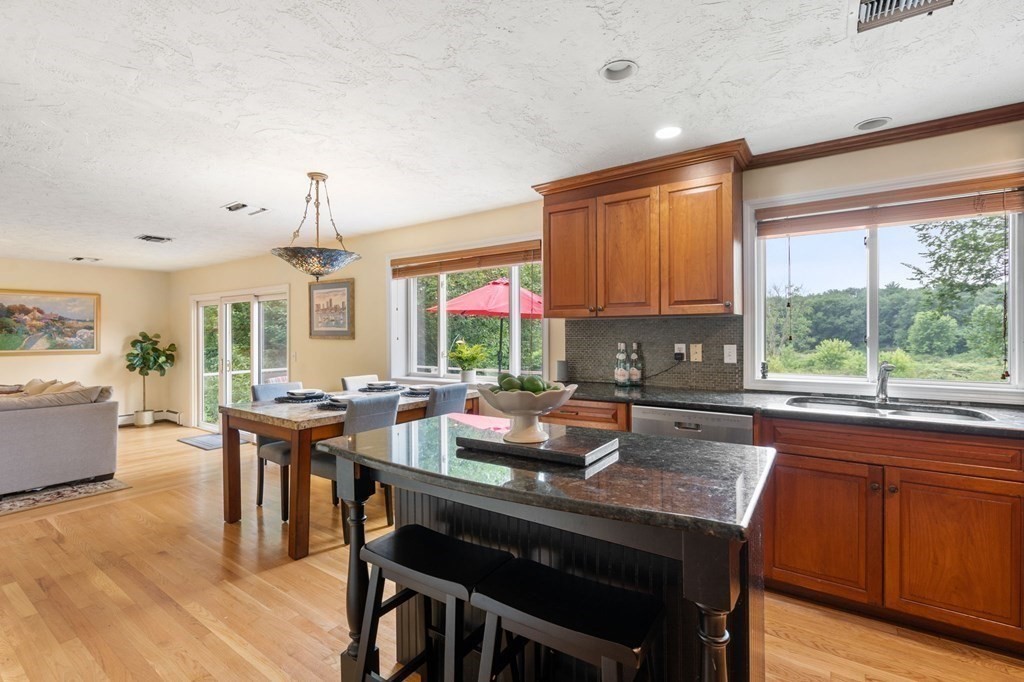 96 Bridge Street Medfield, MA 02052 - Photo 9 of 41 a view of a dining room with furniture window and wooden floor