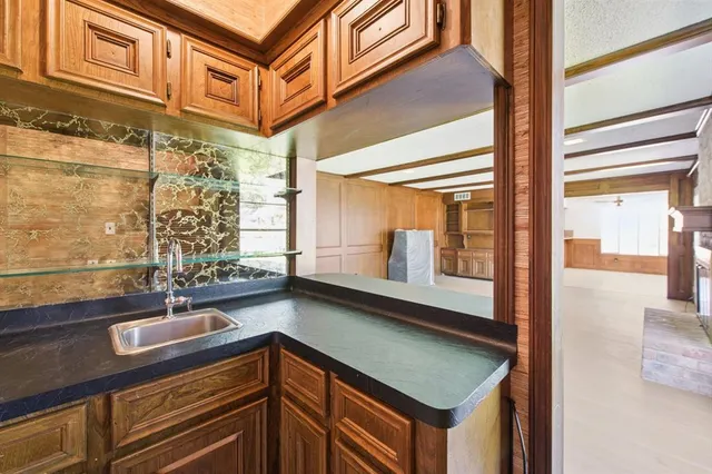 a kitchen with a sink and a window