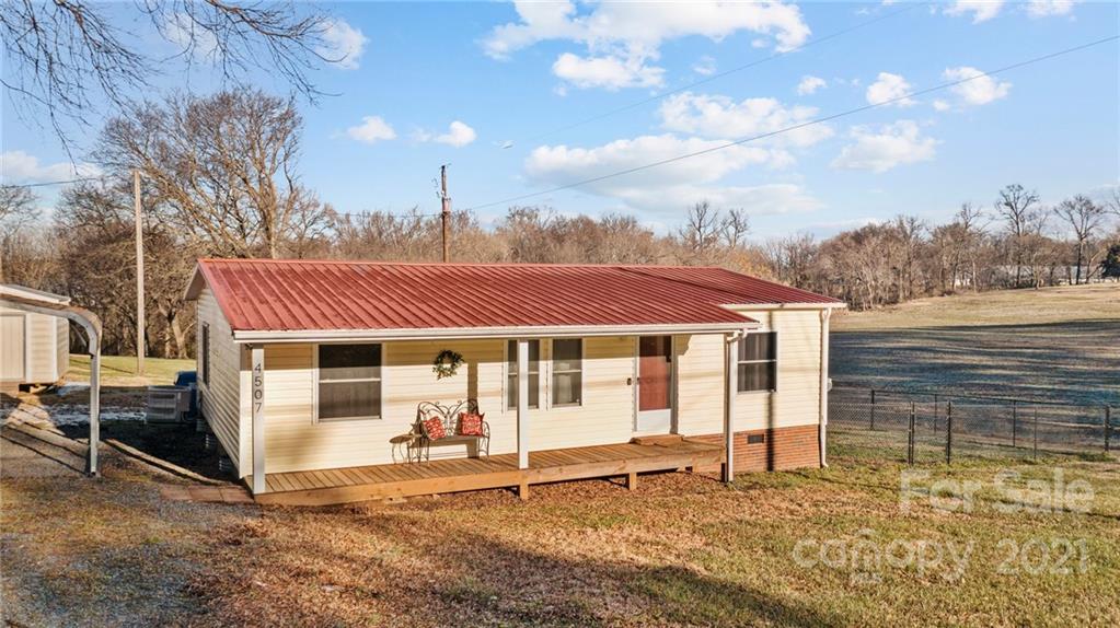 4507 Morgan Mill Road Monroe, NC 28110 - Photo 2 of 33 a white house with a large window and yard
