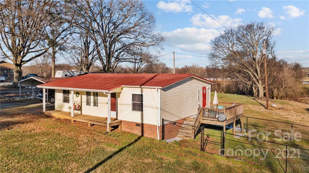 4507 Morgan Mill Road Monroe, NC 28110 - Photo 5 of 33 a view of a house with a yard and sitting area