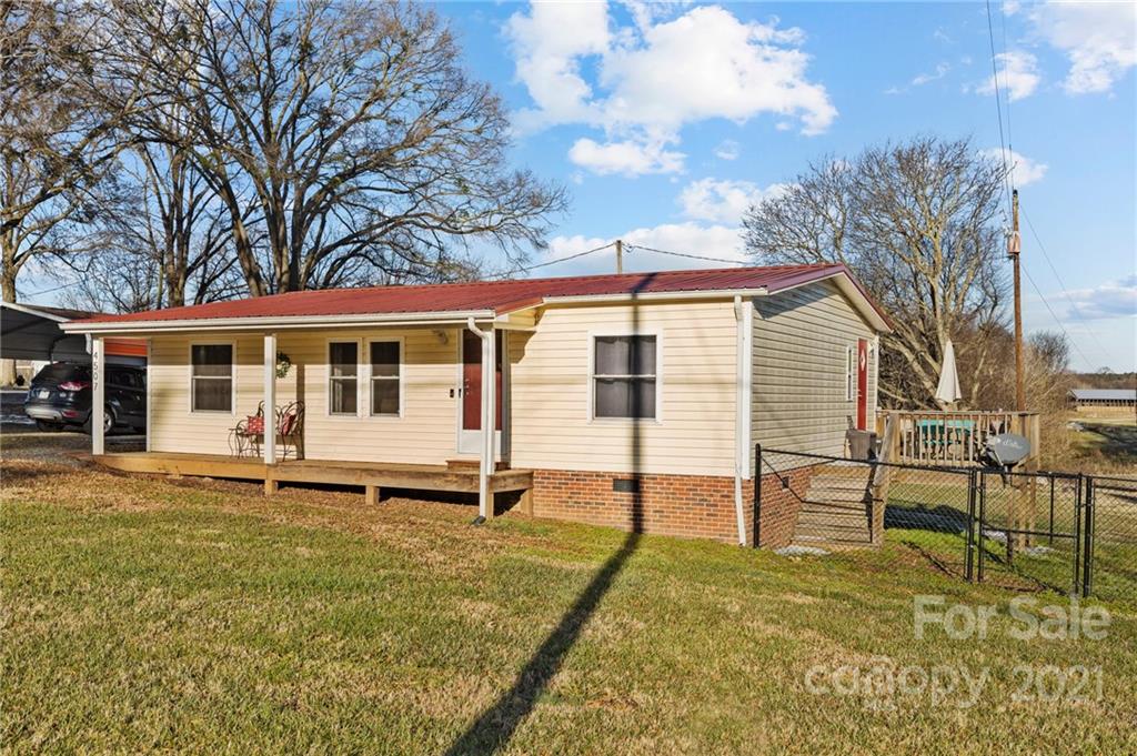 4507 Morgan Mill Road Monroe, NC 28110 - Photo 6 of 33 a house view with a sitting space and garden