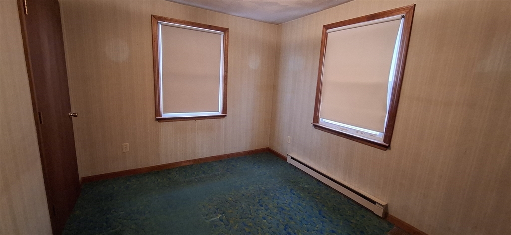 32 3rd Street Webster, MA 01570 - Photo 6 of 13 an empty room with windows