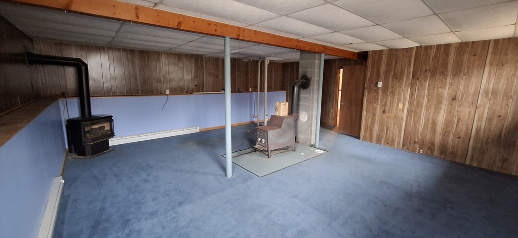 32 3rd Street Webster, MA 01570 - Photo 8 of 13 a view of a livingroom with furniture and staircase