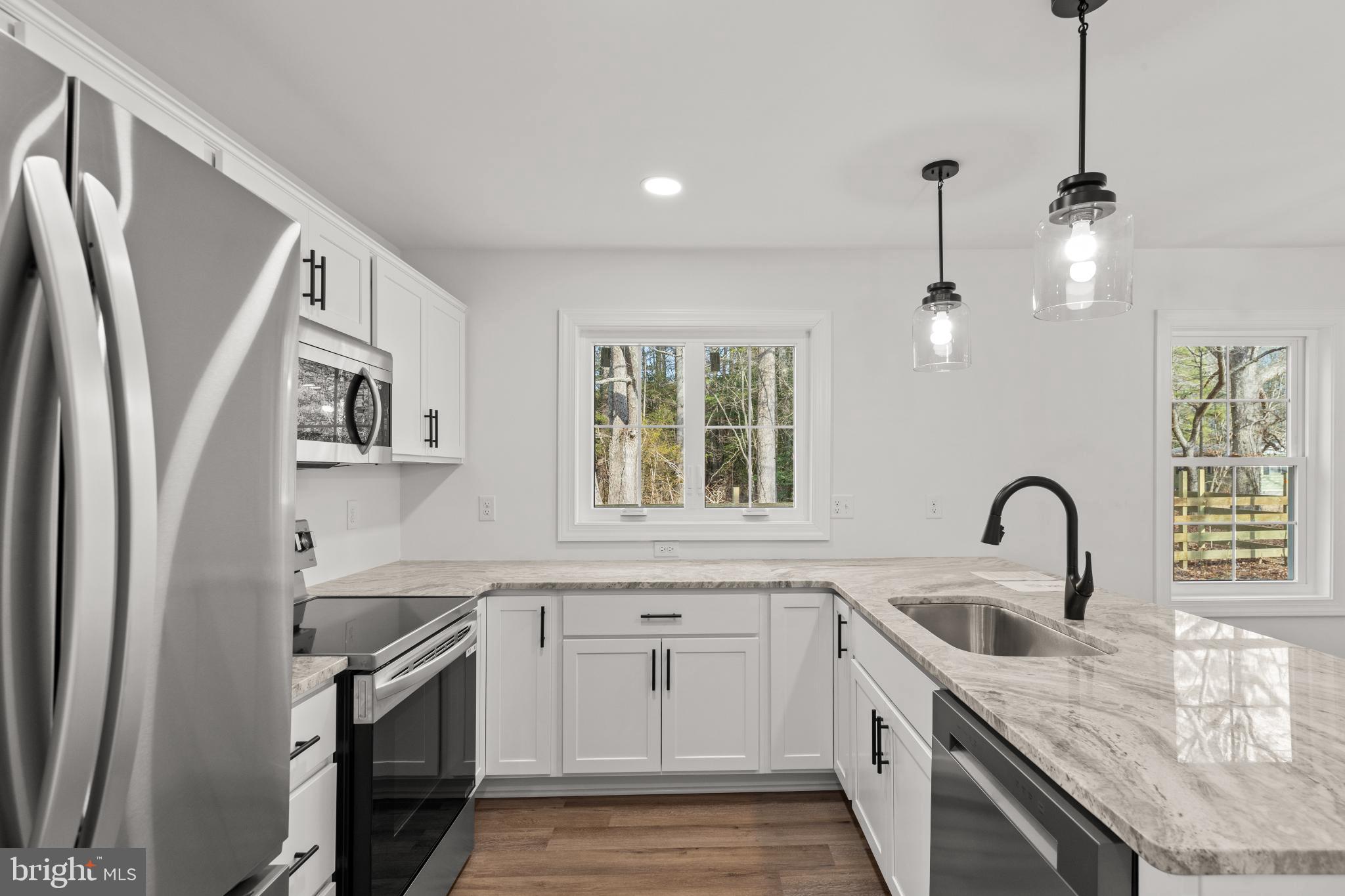 22202 Wetipquin Road Quantico, MD 21856 - Photo 23 of 28 Modern kitchen with sleek finishes and light.
