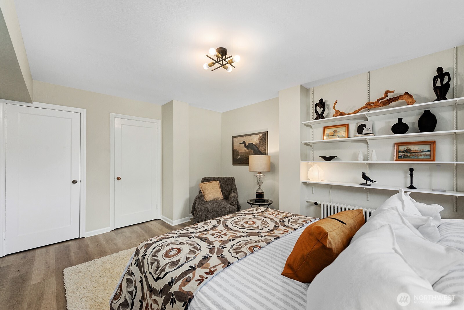 4407 Southwest Alaska Street, Unit 11 Seattle, WA 98116 - Photo 11 of 24 a bedroom with a bed and closet