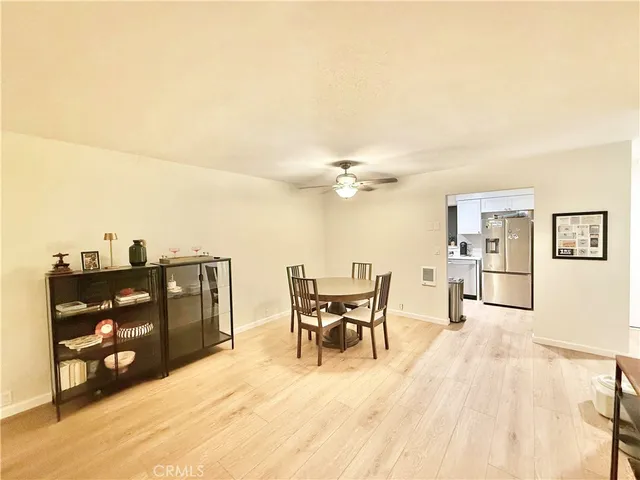 a kitchen with sink cabinets and wooden floor