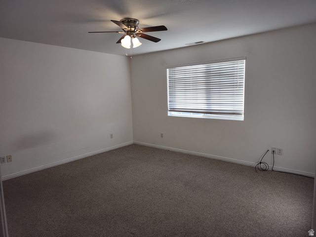 1735 West 540 North, Unit 1402 St. George, UT 84770 - Photo 9 of 14 Empty room featuring carpet floors and a ceiling fan