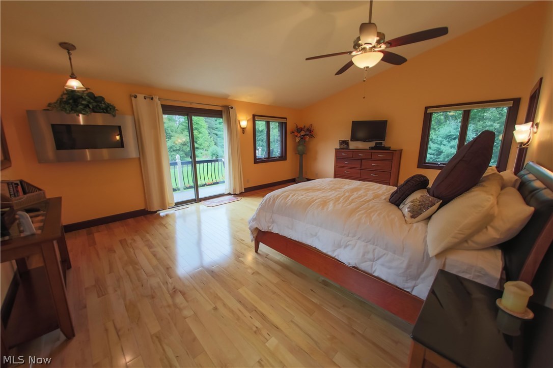 6290 Riverview Road Peninsula, OH 44264 - Photo 15 of 35 1st floor master bedroom w/ private balcony & vaulted ceiling.