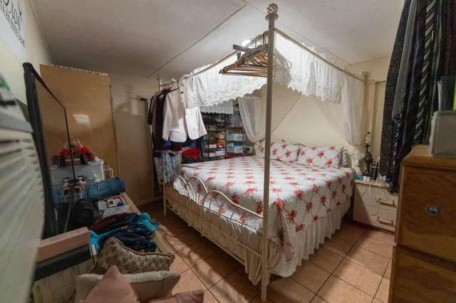 a bedroom with a bed and a walk in closet