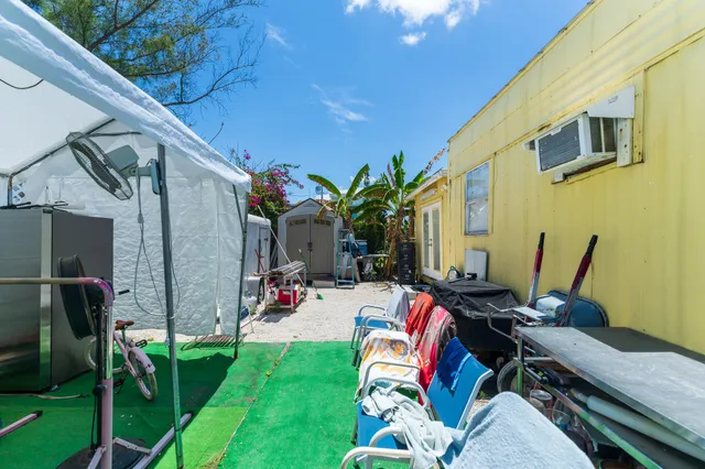 a view of house with a swimming pool
