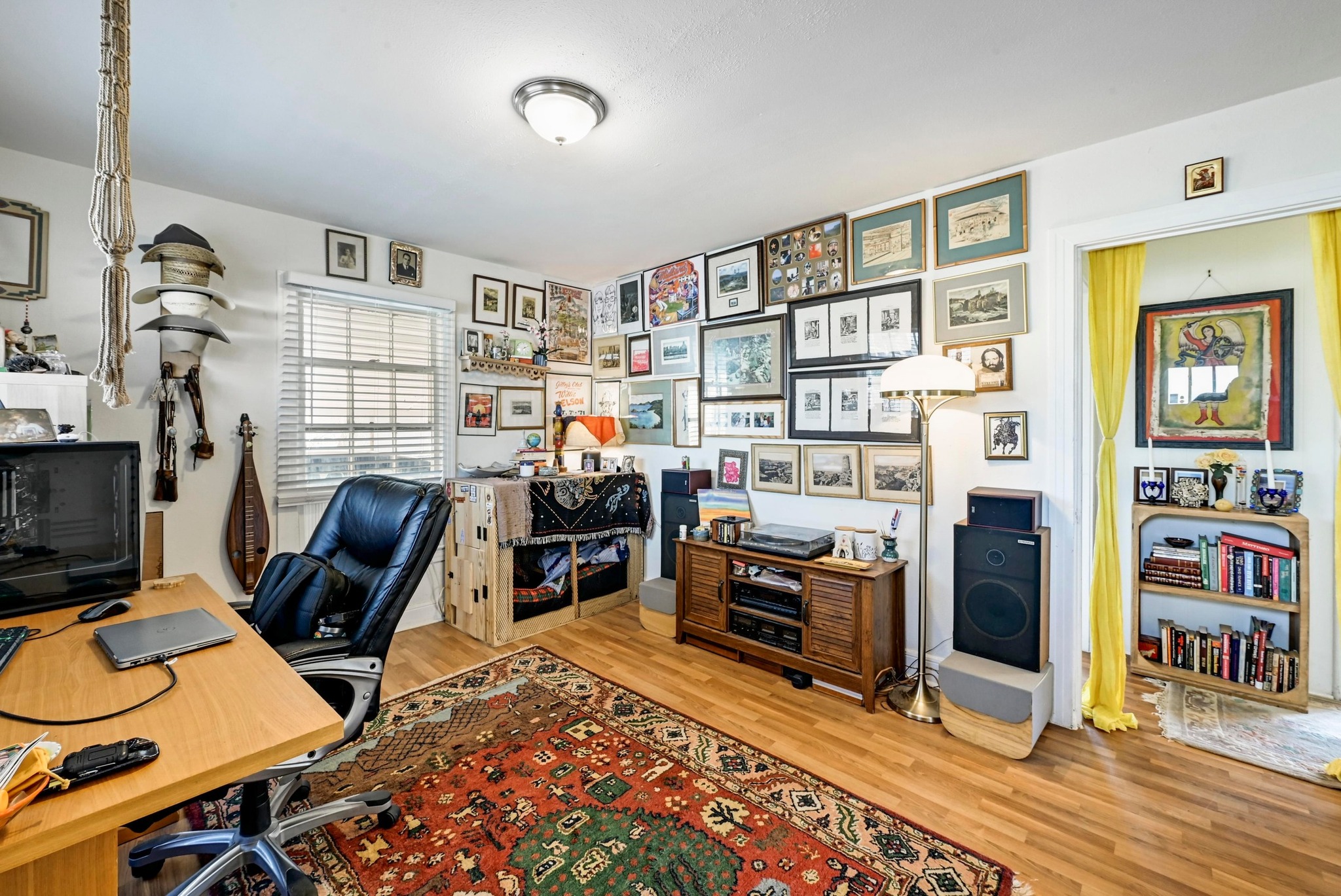 4530 Avenue D, Unit B Austin, TX 78751 - Photo 5 of 29 a view of a workspace with furniture and toys
