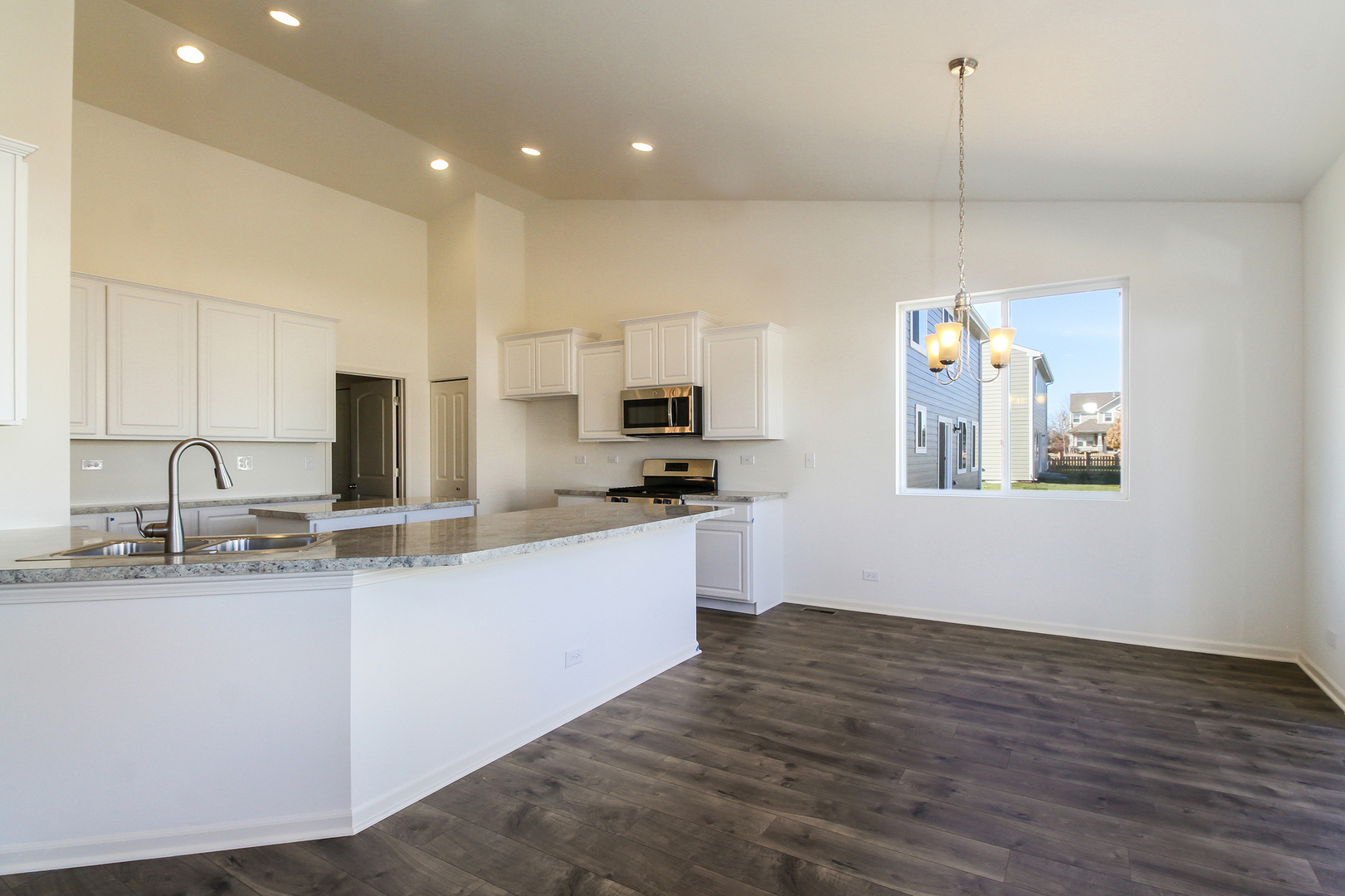 2080 Brandon Hill Road New Lenox, IL 60451 - Photo 5 of 15 a kitchen with granite countertop a sink stainless steel appliances and white cabinets
