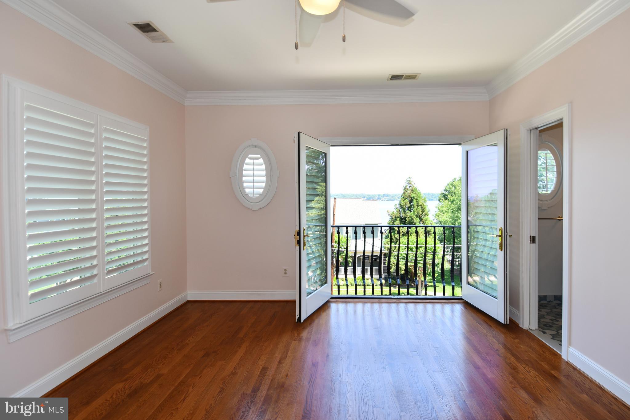7808 Southdown Road Alexandria, VA 22308 - Photo 82 of 99 a view of a room with wooden floor and a window
