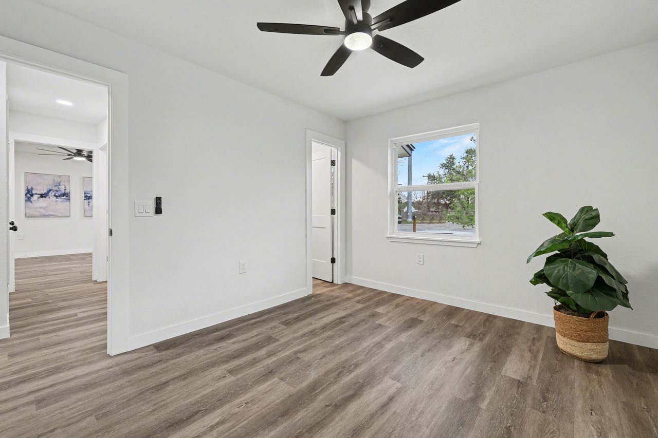 2103 Fordham Cove Austin, TX 78723 - Photo 16 of 36 a view of empty room with wooden floor