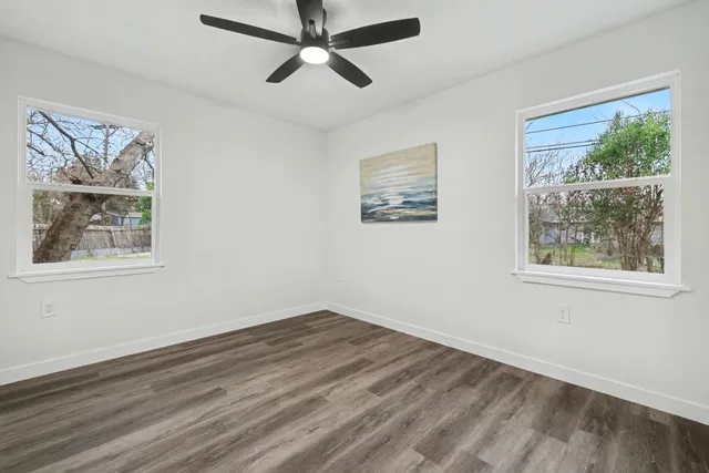 a view of a kitchen with wooden floor