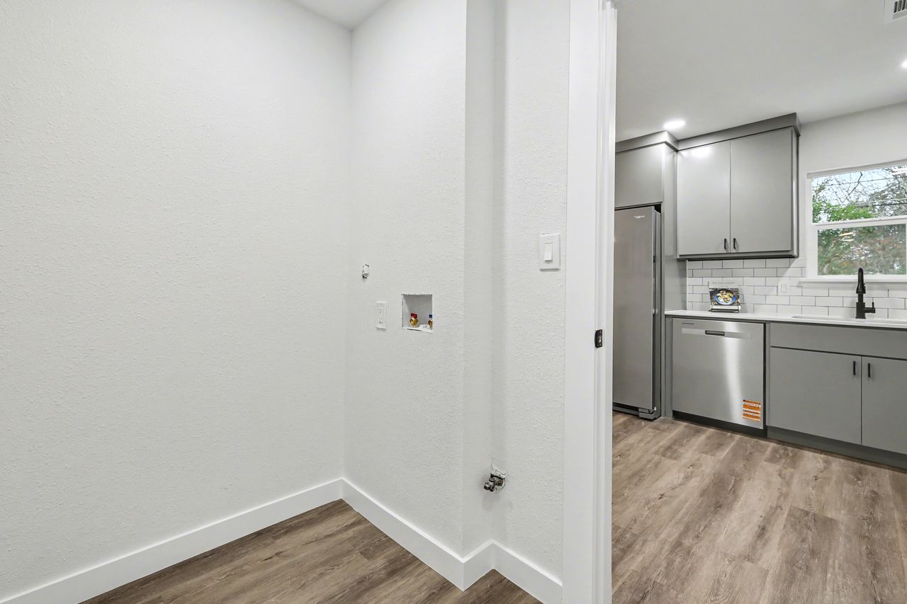 2103 Fordham Cove Austin, TX 78723 - Photo 29 of 36 a view of a kitchen with wooden floor
